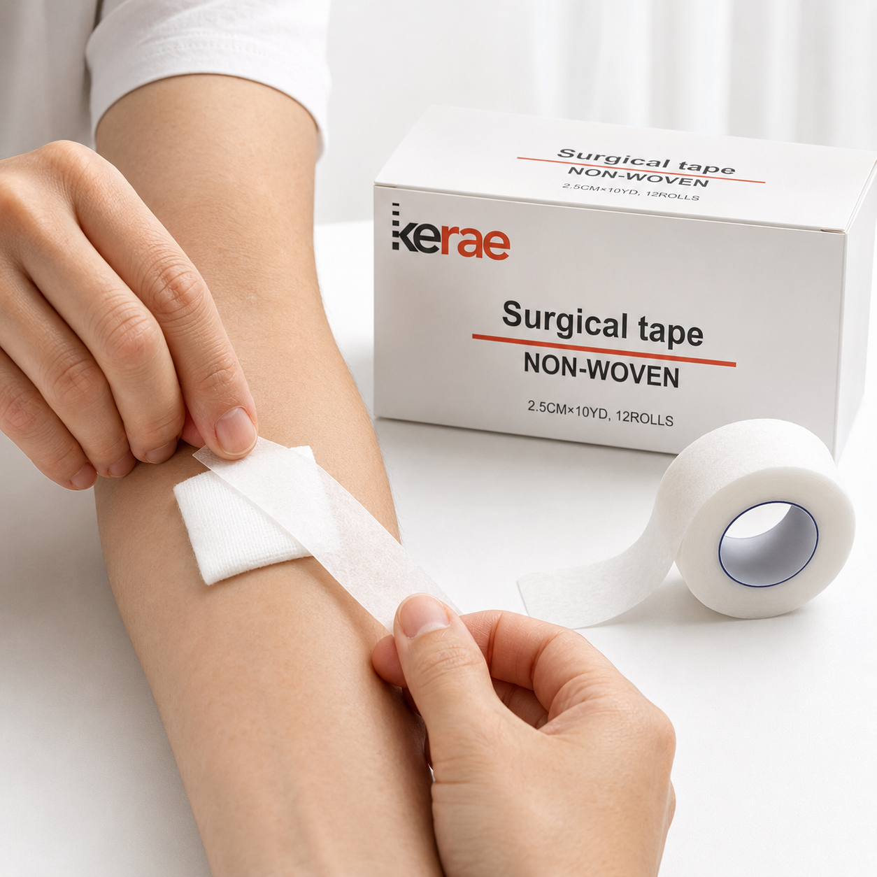 Applying Kerae non-woven surgical tape over a gauze dressing on a forearm